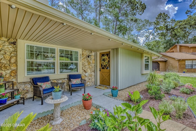 887 Sugar House Ct, Port Orange, FL 32129 - view of exterior entry featuring stone siding and board and batten siding