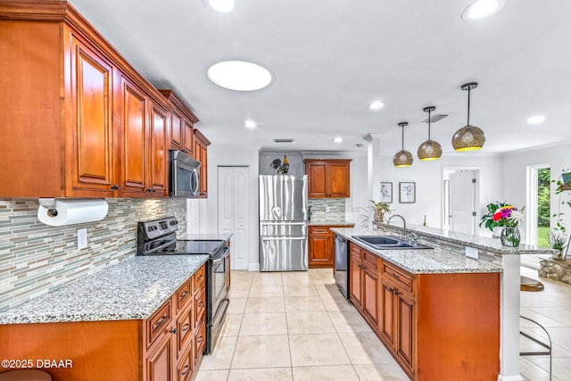 887 Sugar House Ct, Port Orange, FL 32129 - kitchen featuring stainless steel appliances, a breakfast bar area, decorative backsplash, light tile patterned floors, and brown cabinets