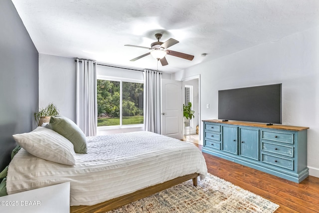887 Sugar House Ct, Port Orange, FL 32129 - bedroom with wood finished floors and a ceiling fan