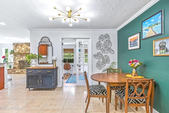 887 Sugar House Ct, Port Orange, FL 32129 - dining room featuring a chandelier, a textured ceiling, light tile patterned floors, and crown molding