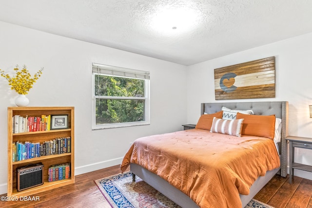 887 Sugar House Ct, Port Orange, FL 32129 - bedroom with wood-type flooring and a textured ceiling