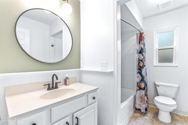887 Sugar House Ct, Port Orange, FL 32129 - bathroom with vanity, wainscoting, and shower / tub combo