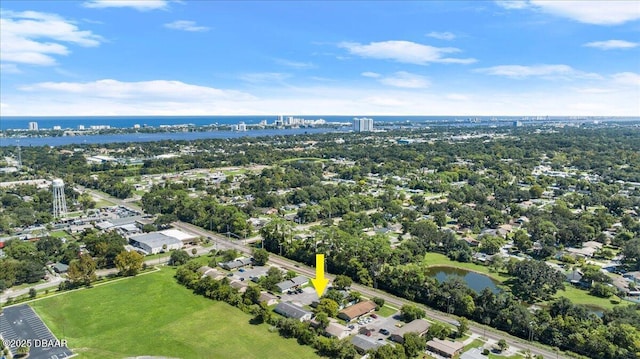 birds eye view of property with a water view