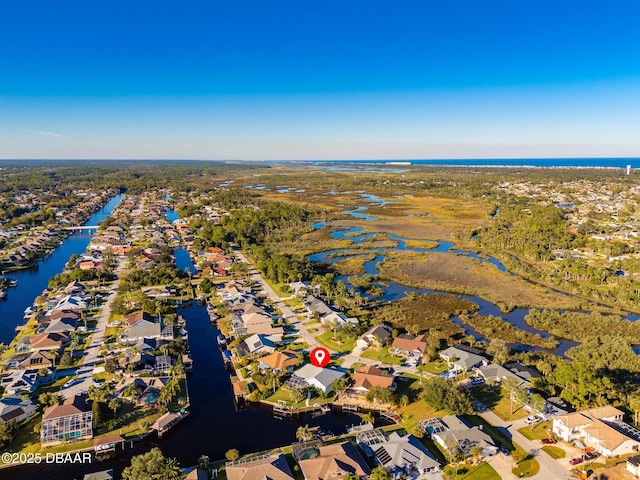bird's eye view with a water view and a residential view