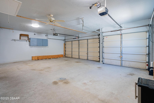 garage featuring a garage door opener and ceiling fan
