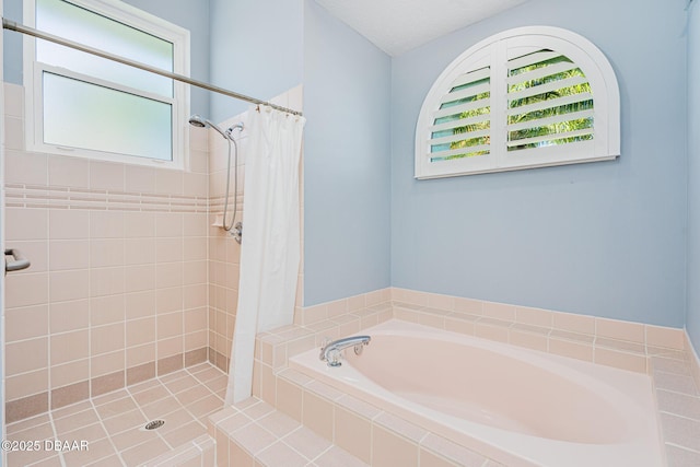 bathroom with a shower stall and a bath