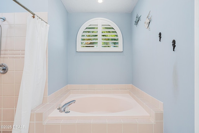 bathroom featuring tiled shower and a bath