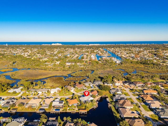 bird's eye view featuring a water view and a residential view