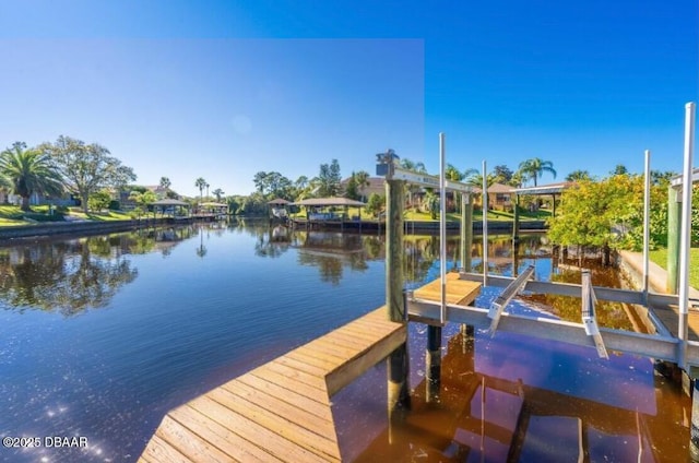 view of dock featuring a water view and boat lift