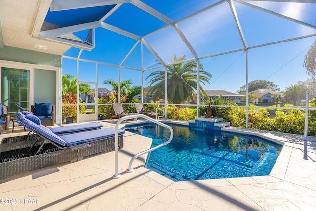 pool featuring a residential view, a patio, and glass enclosure