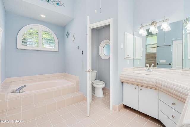 full bath with a garden tub, toilet, tile patterned flooring, and vanity