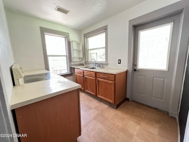 kitchen featuring stove and sink