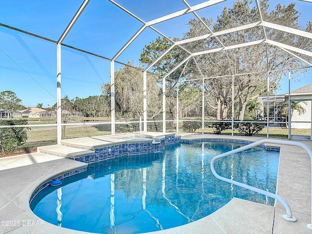 view of swimming pool featuring an in ground hot tub, a patio area, and glass enclosure