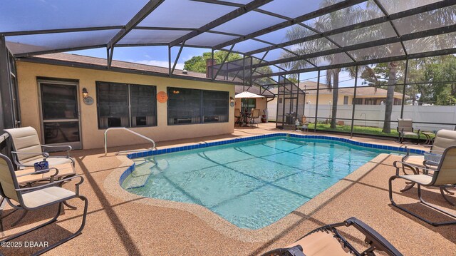 2504 Sabal Palm Dr, Edgewater, FL 32141 - view of swimming pool with glass enclosure, fence, a fenced in pool, and a patio area