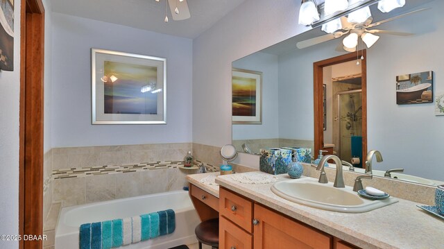 2504 Sabal Palm Dr, Edgewater, FL 32141 - full bathroom featuring vanity, a ceiling fan, a bath, and a shower stall