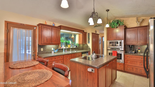 kitchen featuring a sink, dark countertops, tasteful backsplash, and stainless steel appliances