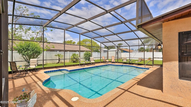view of pool featuring a fenced in pool, a fenced backyard, a patio area, and a storage unit