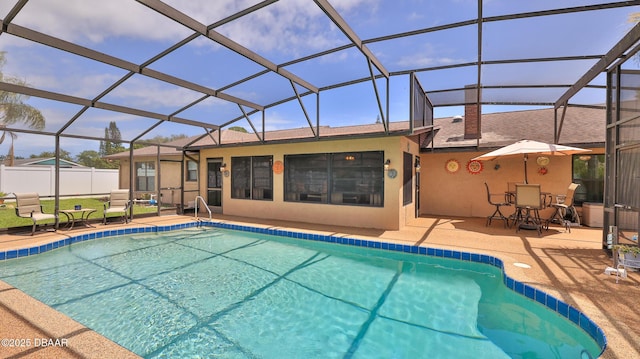 outdoor pool with a patio area and a lanai