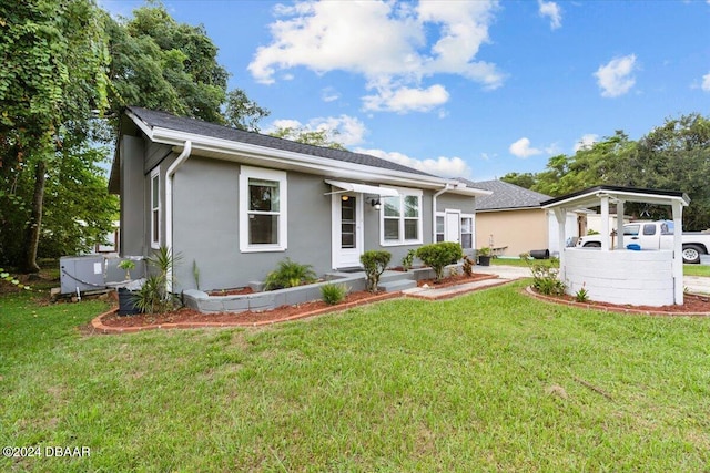 ranch-style home with a front lawn