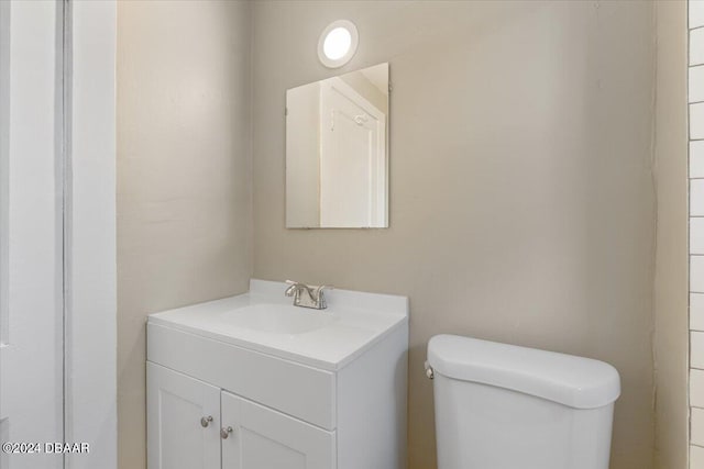 bathroom with toilet and vanity