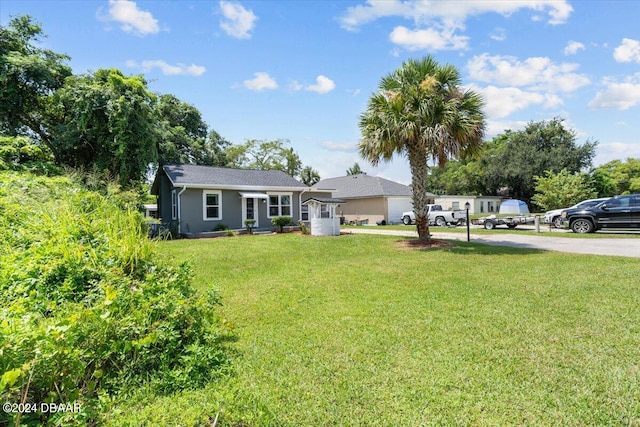 ranch-style home with a front lawn