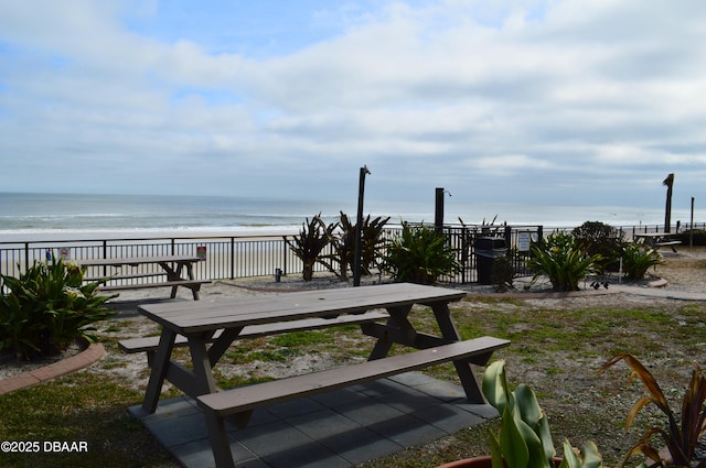 view of property's community with a view of the beach and a water view