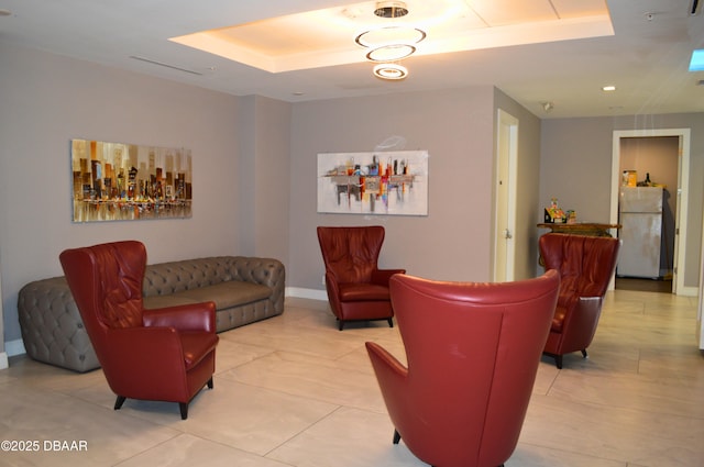 living room with a tray ceiling