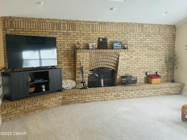 unfurnished living room with carpet and crown molding