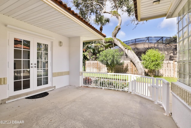 view of patio / terrace featuring french doors and fence