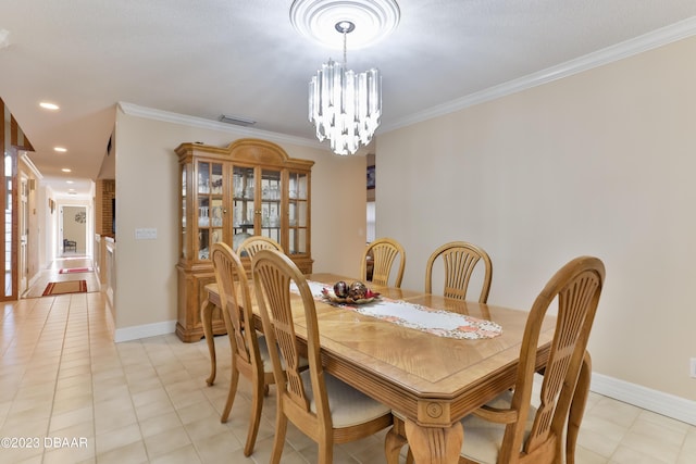 dining room with baseboards, ornamental molding, a notable chandelier, and recessed lighting