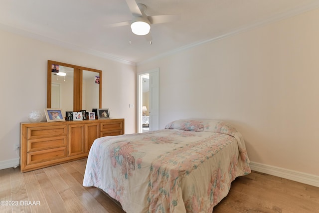 bedroom with ornamental molding, baseboards, ceiling fan, and light wood finished floors