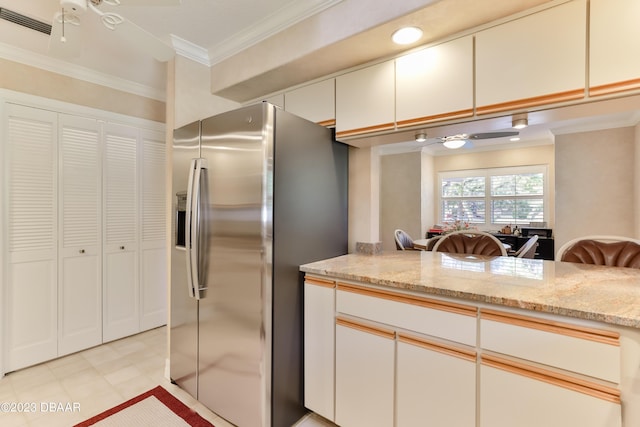 kitchen with white cabinetry, a ceiling fan, and stainless steel fridge with ice dispenser