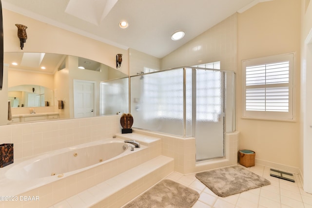 bathroom featuring lofted ceiling, a tub with jets, a stall shower, and tile patterned floors