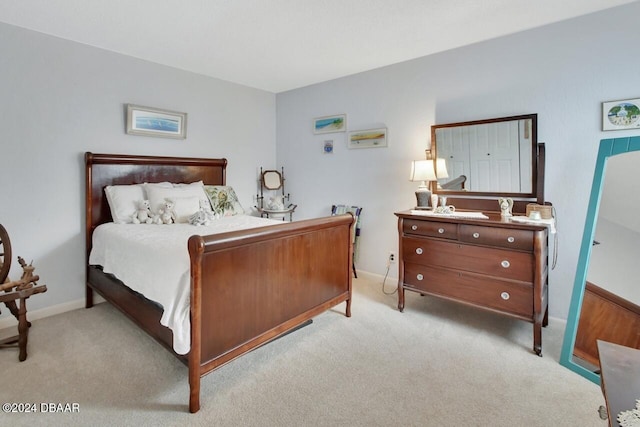 bedroom featuring light colored carpet