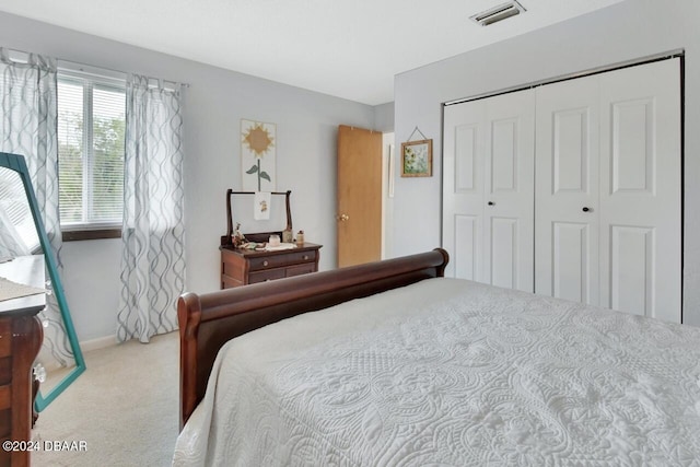 carpeted bedroom featuring a closet