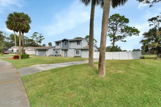 view of front facade with a garage and a front lawn