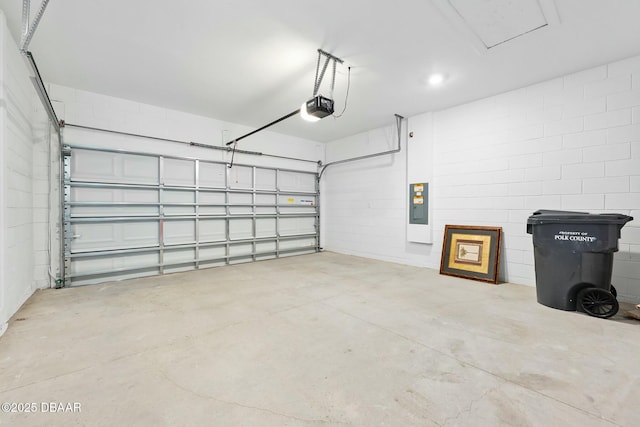 1372 Lombardi Ct, Poinciana, FL 34759 - garage featuring a garage door opener and electric panel