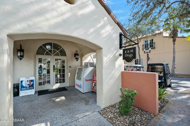 1372 Lombardi Ct, Poinciana, FL 34759 - view of exterior entry with french doors