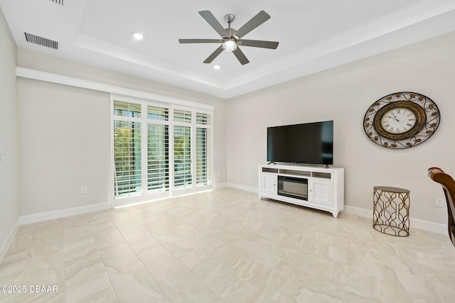 1372 Lombardi Ct, Poinciana, FL 34759 - unfurnished living room featuring ceiling fan and a raised ceiling