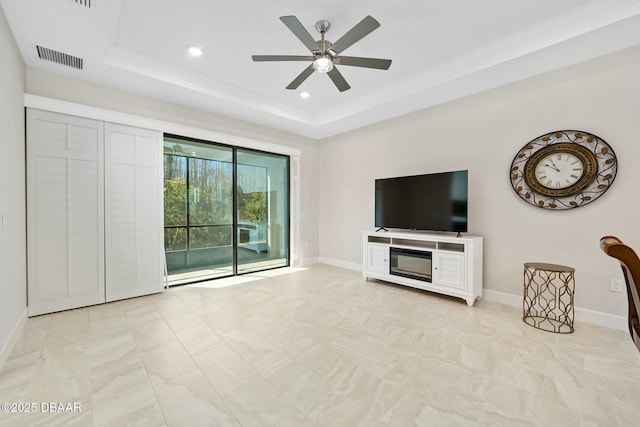 1372 Lombardi Ct, Poinciana, FL 34759 - unfurnished living room with ceiling fan and a tray ceiling