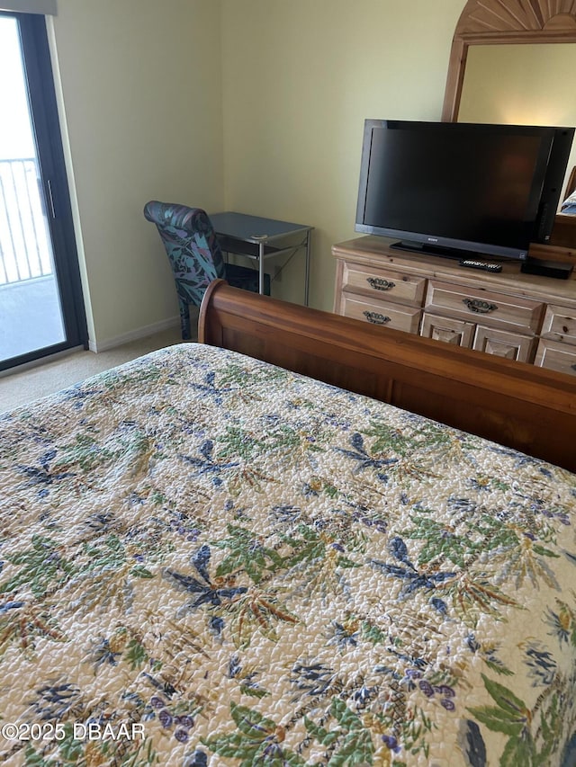 carpeted bedroom featuring access to exterior