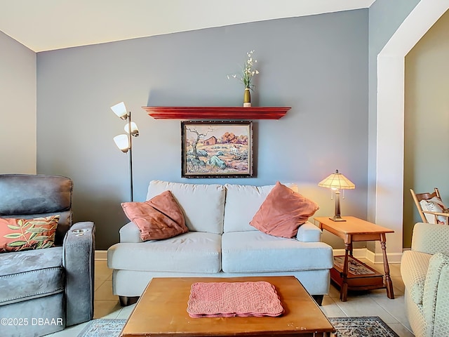 living room featuring baseboards and tile patterned floors