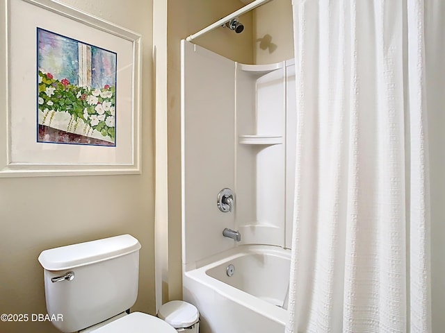 bathroom with toilet and shower / tub combo