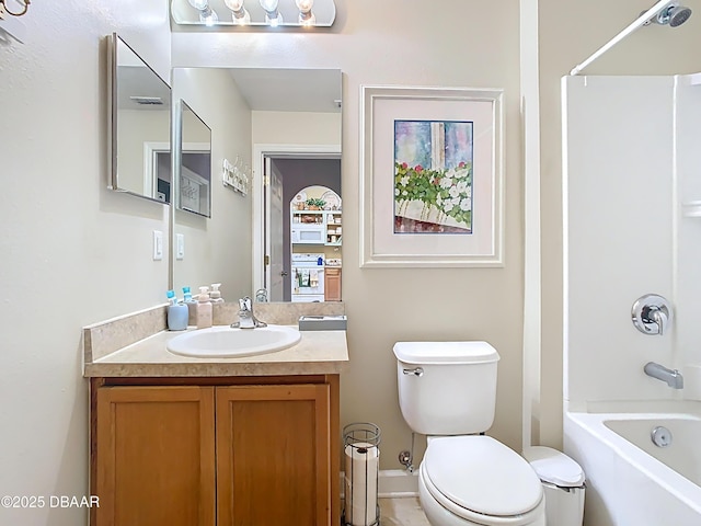 full bathroom featuring toilet, vanity, and shower / bathing tub combination