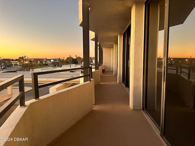 view of balcony at dusk