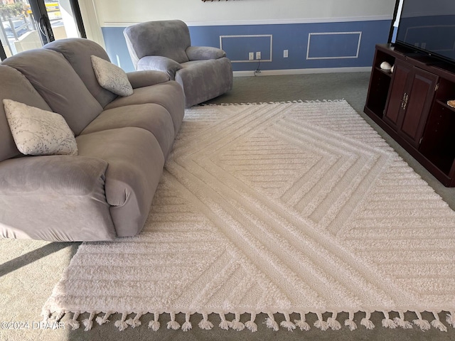 living room featuring carpet and ornamental molding