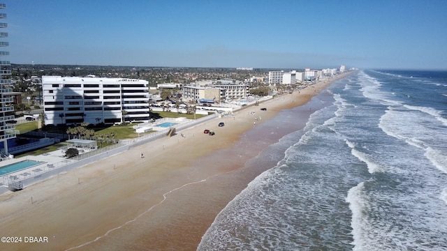 bird's eye view featuring a view of the beach and a water view