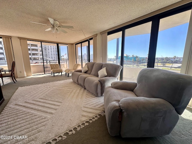 sunroom featuring ceiling fan