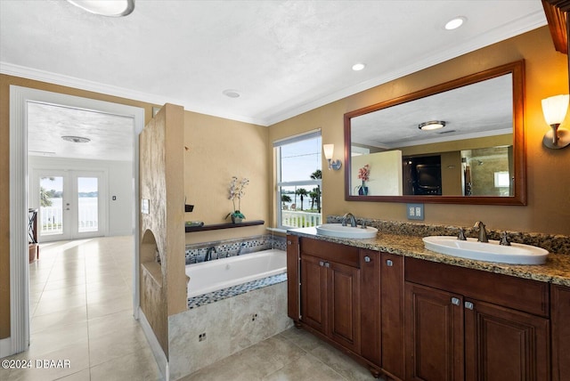 bathroom featuring plenty of natural light, crown molding, and tiled tub