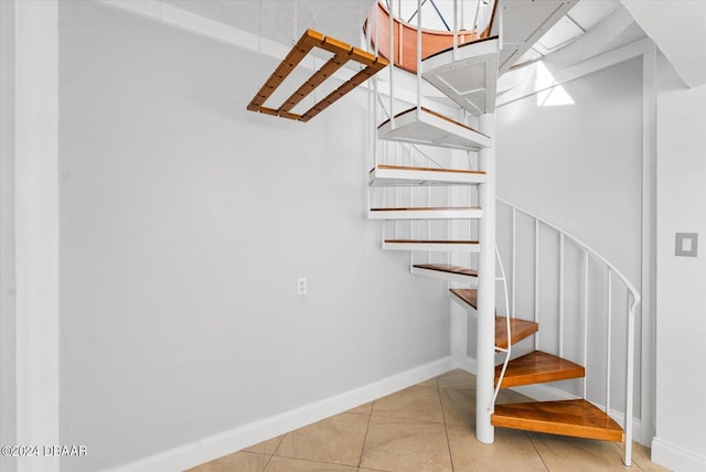 stairway featuring tile patterned floors